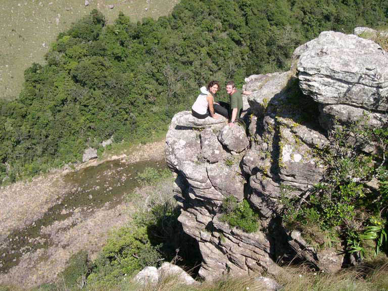 ash and lu on rock on cliff